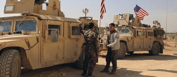 March 7, 2017 frame grab from video provided by Arab 24 network, shows fighters from the Syrian Democratic forces standing near US military vehicles on the outskirts of the Syrian town, Manbij, a flashpoint between Turkish troops and allied Syrian fighters and U.S.-backed Kurdish fighters, in al-Asaliyah village, Aleppo province, Syria - Sputnik International