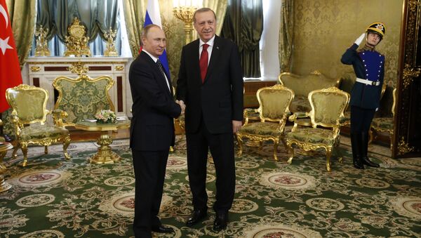 Russian President Vladimir Putin (L) shakes hands with Turkey's President Recep Tayyip Erdogan (R) ahead of their meeting in the Kremlin in Moscow, on March 10, 2017 - Sputnik International