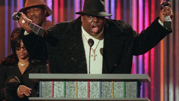In this December 6, 1995 file photo, Notorious B.I.G., who won rap artist and rap single of the year, clutches his awards at the podium during the annual Billboard Music Awards in New York. - Sputnik International