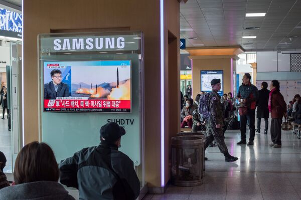 A television screen shows news coverage of a North Korean rocket launch at Seoul station on March 7, 2017 A television screen shows news coverage of a North Korean rocket launch at Seoul station on March 7, 2017 - Sputnik International