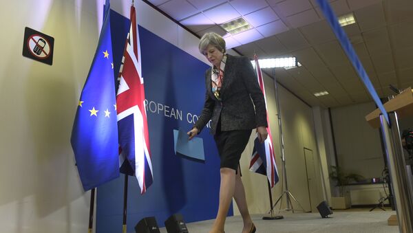 British Prime Minister Theresa May leaves after a press conference during a European Summit at the EU headquarters in Brussels on March 9, 2017 - Sputnik International