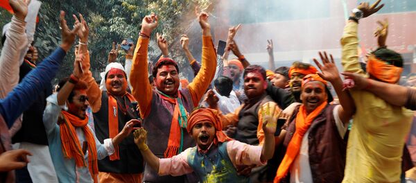 Supporters of India’s Bharatiya Janata Party (BJP) celebrate after learning of the initial poll results at the party headquarters in Lucknow, India March 11, 2017 Supporters of India’s Bharatiya Janata Party (BJP) celebrate after learning of the initial poll results at the party headquarters in Lucknow, India March 11, 2017 - Sputnik International