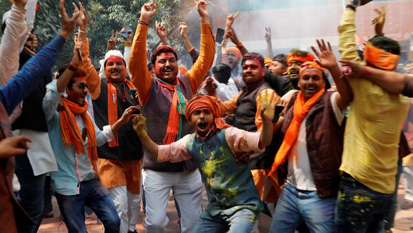 Supporters of India’s Bharatiya Janata Party (BJP) celebrate after learning of the initial poll results at the party headquarters in Lucknow, India March 11, 2017 - Sputnik International
