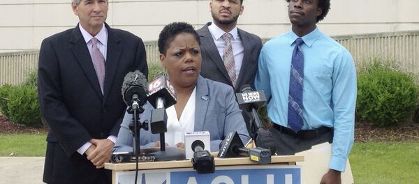 FILE - In this Monday, May 9, 2016 file photo, Jennifer Riley-Collins, executive director of the American Civil Liberties Union of Mississippi, center, speaks in Jackson, Miss., about a lawsuit the group filed against the state over House Bill 1523, which would allow workers to cite their own religious objections to same-sex marriage and deny services to citizens. FILE - In this Monday, May 9, 2016 file photo, Jennifer Riley-Collins, executive director of the American Civil Liberties Union of Mississippi, center, speaks in Jackson, Miss., about a lawsuit the group filed against the state over House Bill 1523, which would allow workers to cite their own religious objections to same-sex marriage and deny services to citizens. - Sputnik International