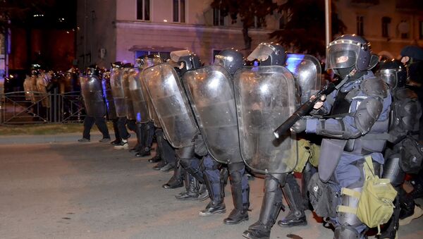 Riot police make a line during riots in the Georgian Black Sea port of Batumi, early Sunday, March 12, 2017. - Sputnik International