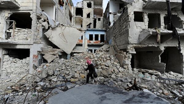 A man walks near damaged buildings in Aleppo, Syria - Sputnik International