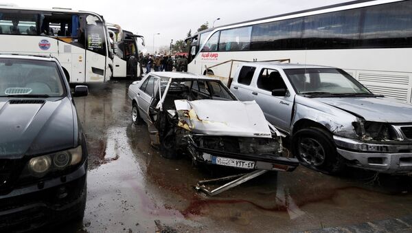 Damaged vehicles are pictured at the site of an attack by two suicide bombers in Damascus, Syria - Sputnik International