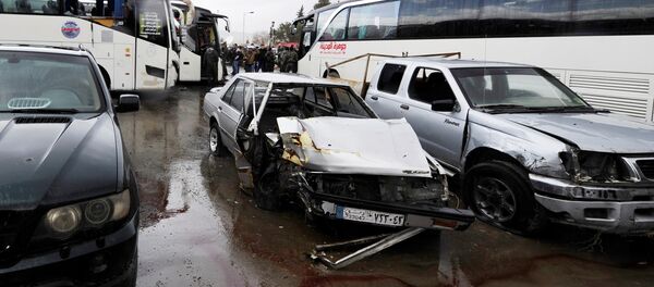 Damaged vehicles are pictured at the site of an attack by two suicide bombers in Damascus, Syria Damaged vehicles are pictured at the site of an attack by two suicide bombers in Damascus, Syria - Sputnik International