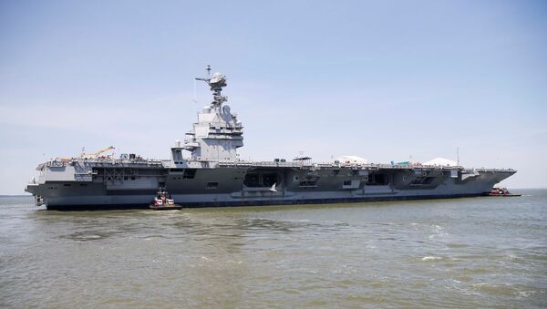 Pre-Commissioning Unit Gerald R. Ford (CVN 78) is maneuvered by tug boats in the James River during the aircraft carrier's turn ship evolution in Newport News, Virginia, U.S. June 11, 2016. - Sputnik International