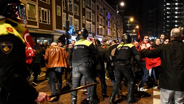 Demonstrators clash with riot police during running battles in the streets near the Turkish consulate in Rotterdam, Netherlands March 12, 2017. - Sputnik International