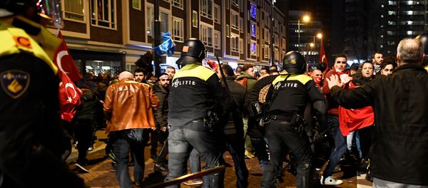 Demonstrators clash with riot police during running battles in the streets near the Turkish consulate in Rotterdam, Netherlands March 12, 2017. - Sputnik International
