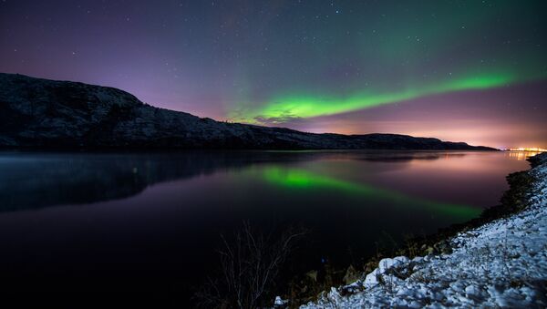 The Aurora Borealis or Northern Lights illuminate the night sky on November 12, 2015 near the town of Kirkenes in northern Norway. - Sputnik International