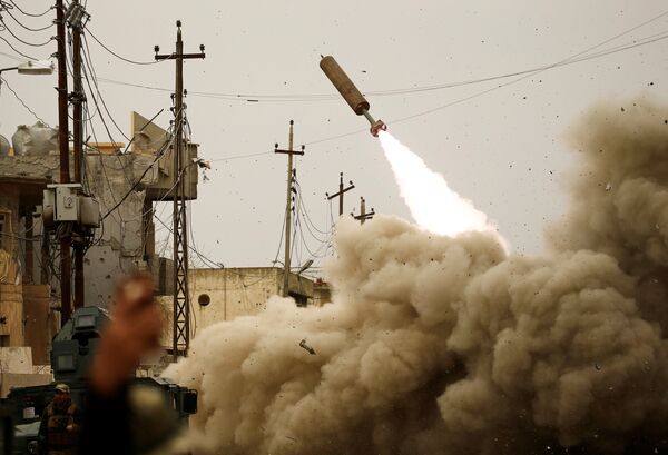 Iraqi rapid response members fire a missile against DAESH militants during a battle with the militants in Mosul, Iraq, March 11, 2017. Iraqi rapid response members fire a missile against DAESH militants during a battle with the militants in Mosul, Iraq, March 11, 2017. - Sputnik International