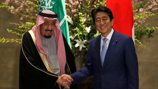 Saudi King Salman bin Abdulaziz Al-Saud (L) and Japan's Prime Minister Shinzo Abe shake hands before their meeting at Abe's official residence in Tokyo, Japan, March 13, 2017. - Sputnik International