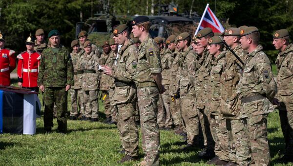 Britain's Prince Harry attends a special ceremony with presentation of the British Certificates of Commendation to Estonian servicemen during NATO's Spring Storm exercise in Otepaa, Estonia, Saturday, May 17, 2014. - Sputnik International