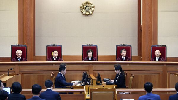 South Korean acting Constitutional Court's Chief Judge Lee Jung-mi, top center, speaks during the final ruling of South Korean President Park Geun-hye's impeachment at the Constitutional Court in Seoul, South Korea - Sputnik International