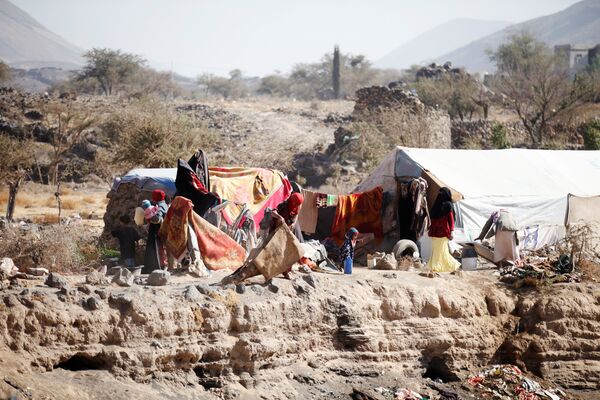 People are pictured near their tent at a camp for internally displaced people in Dharawan, near the capital Sanaa, Yemen, February 28, 2017 People are pictured near their tent at a camp for internally displaced people in Dharawan, near the capital Sanaa, Yemen, February 28, 2017 - Sputnik International