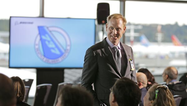 Pat Shanahan, senior vice president of Airplane Programs for Boeing Commercial Airplanes, greets guests at a re-opening ceremony for Boeing's newly expanded 737 delivery center, Monday, Oct. 19, 2015, at Boeing Field in Seattle - Sputnik International