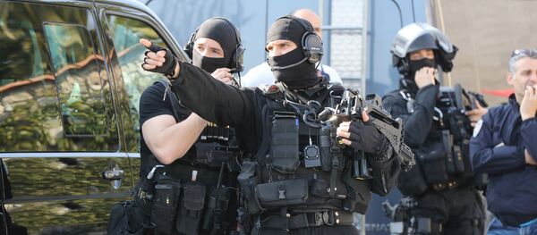 A member of the RAID (Search, Assistance, Intervention, Deterrence) French police unit gestures near the Tocqueville high school in the southern French town of Grasse, on March 16, 2017 following a shooting that left eight people injured A member of the RAID (Search, Assistance, Intervention, Deterrence) French police unit gestures near the Tocqueville high school in the southern French town of Grasse, on March 16, 2017 following a shooting that left eight people injured - Sputnik International