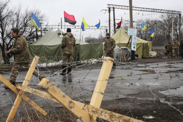 (File) Ukrainian nationalist protesters and military veterans take part in a blockade against ongoing trade with the Donbass self-proclaimed republics, on February 23, 2017, in Kryvyi Torets railway station, Donetsk region - Sputnik International