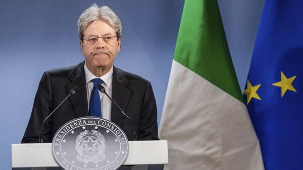 Italian Prime Minister Paolo Gentiloni listens to questions during a media conference at the end of an EU summit in Brussels on Friday, March 10, 2017 - Sputnik International