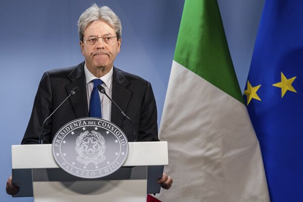Italian Prime Minister Paolo Gentiloni listens to questions during a media conference at the end of an EU summit in Brussels on Friday, March 10, 2017 - Sputnik International