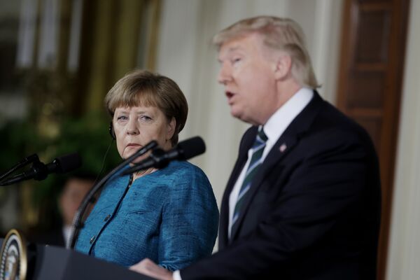 German Chancellor Angela Merkel listens as President Donald Trump speaks during their joint news conference in the East Room of the White House in Washington, Friday, March 17, 2017 German Chancellor Angela Merkel listens as President Donald Trump speaks during their joint news conference in the East Room of the White House in Washington, Friday, March 17, 2017 - Sputnik International