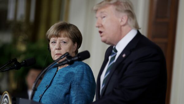 German Chancellor Angela Merkel listens as President Donald Trump speaks during their joint news conference in the East Room of the White House in Washington, Friday, March 17, 2017 - Sputnik International