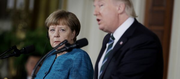 German Chancellor Angela Merkel listens as President Donald Trump speaks during their joint news conference in the East Room of the White House in Washington, Friday, March 17, 2017 - Sputnik International