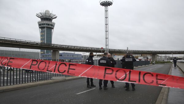 Police officers cordon off the access to the Orly airport, south of Paris, Saturday, March, 18, 2017. A man was shot to death Saturday after trying to seize the weapon of a soldier guarding Paris' Orly Airport, prompting a partial evacuation of the terminal, police said. Authorities warned visitors to avoid the area while an ongoing police operation was underway. - Sputnik International
