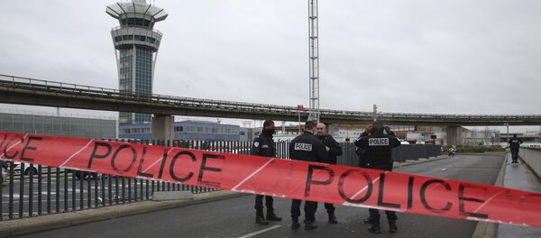 Police officers cordon off the access to the Orly airport, south of Paris, Saturday, March, 18, 2017. A man was shot to death Saturday after trying to seize the weapon of a soldier guarding Paris' Orly Airport, prompting a partial evacuation of the terminal, police said. Authorities warned visitors to avoid the area while an ongoing police operation was underway. Police officers cordon off the access to the Orly airport, south of Paris, Saturday, March, 18, 2017. A man was shot to death Saturday after trying to seize the weapon of a soldier guarding Paris' Orly Airport, prompting a partial evacuation of the terminal, police said. Authorities warned visitors to avoid the area while an ongoing police operation was underway. - Sputnik International
