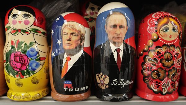 In this Monday, Feb. 20, 2017 traditional Russian wooden dolls called Matryoshka depicting US President Donald Trump, centre left and Russian President Vladimir Putin are displayed for sale at a souvenir street shop in St.Petersburg, Russia - Sputnik International