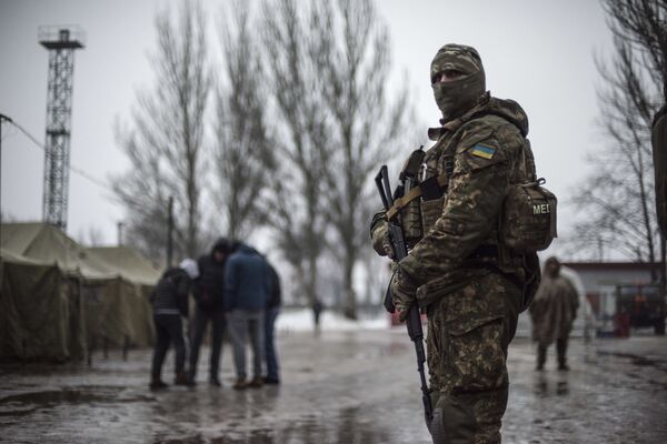 A Ukrainian serviceman patrols at the humanitarian aid center in Avdiivka, Ukraine, Saturday, Feb. 4, 2017 A Ukrainian serviceman patrols at the humanitarian aid center in Avdiivka, Ukraine, Saturday, Feb. 4, 2017 - Sputnik International