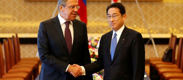 Russian Foreign Minister Sergei Lavrov (L) shakes hands with Japanese Foreign Minister Fumio Kishida at the start of their meeting as a part of Japan-Russia foreign and defence ministers meeting called two-plus-two at Iikura guest house in Tokyo, Japan March 20, 2017. - Sputnik International
