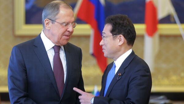 Russian Foreign Minister Sergei Lavrov (L) shakes hands with Japanese Foreign Minister Fumio Kishida at the start of their meeting as a part of Japan-Russia foreign and defence ministers meeting called two-plus-two at Iikura guest house in Tokyo, Japan March 20, 2017. - Sputnik International