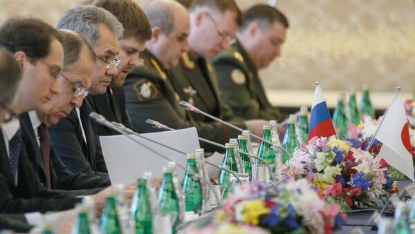 Russian Defense Minister Sergei Shoigu, third left, and Foreign Minister Sergei Lavrov, second left, during two-plus-two talks with Japanese defense and foreign ministers in Tokyo. - Sputnik International