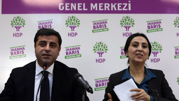 Co-chairmen of pro-Kurdish People's Democratic Party, or HDP, Selahattin Demirtas, left, and Figen Yuksekdag speak to the media in Ankara, Turkey, Sunday, Nov. 1, 2015. Turkey’s ruling Justice and Development Party appeared to sweep back into single-party rule after a stunning victory in Sunday’s parliamentary election. - Sputnik International