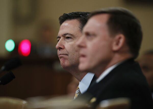 FBI Director James Comey, left, joined by National Security Agency Director Michael Rogers, right, testifies on Capitol Hill in Washington, Monday, March 20, 2017, before the House Intelligence Committee hearing on allegations of Russian interference in the 2016 U.S. presidential election FBI Director James Comey, left, joined by National Security Agency Director Michael Rogers, right, testifies on Capitol Hill in Washington, Monday, March 20, 2017, before the House Intelligence Committee hearing on allegations of Russian interference in the 2016 U.S. presidential election - Sputnik International