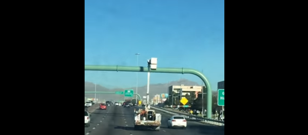 Utility Trucker Drives with Bucket Up Utility Trucker Drives with Bucket Up - Sputnik International