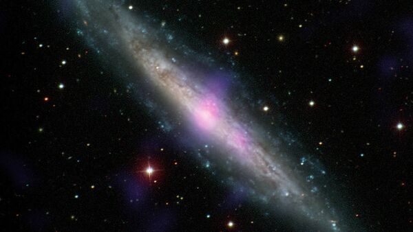 NGC 1448, a galaxy with an active galactic nucleus, is seen in this image combining data from the Carnegie-Irvine Galaxy Survey in the optical range and NuSTAR in the X-ray range. - Sputnik International