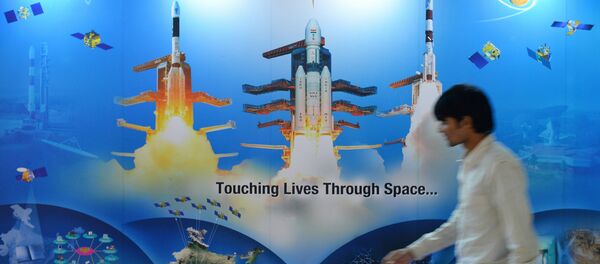 A man walks past a poster of Indian Space Research Organisation (ISRO) A man walks past a poster of Indian Space Research Organisation (ISRO) - Sputnik International