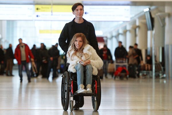 Singer Yulia Samoilova, Russia's Eurovision 2017 contestant, and her husband, Alexei Taran, at Sheremetyevo Airport Singer Yulia Samoilova, Russia's Eurovision 2017 contestant, and her husband, Alexei Taran, at Sheremetyevo Airport - Sputnik International
