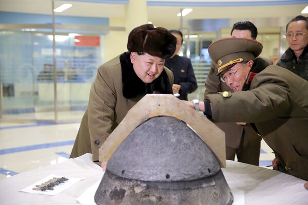North Korean leader Kim Jong Un looks at a rocket warhead tip after a simulated test of atmospheric re-entry of a ballistic missile, at an unidentified location in this undated file photo released by North Korea's Korean Central News Agency (KCNA) in Pyongyang on March 15, 2016. North Korean leader Kim Jong Un looks at a rocket warhead tip after a simulated test of atmospheric re-entry of a ballistic missile, at an unidentified location in this undated file photo released by North Korea's Korean Central News Agency (KCNA) in Pyongyang on March 15, 2016. - Sputnik International