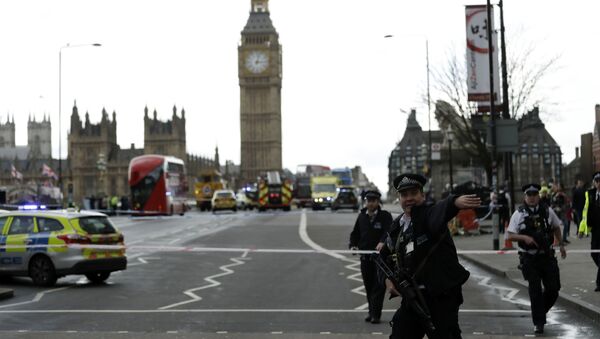 Police secure the area on the south side of Westminster Bridge close to the Houses of Parliament in London - Sputnik International