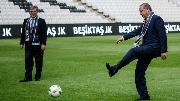 Turkish President Recep Tayyip Erdogan (R) kicks the ball next to former Turkish President Abdullah Gul on April 10, 2016 in Istanbul at Besiktas football club's Vodafone Arena new stadium on its opening day. - Sputnik International