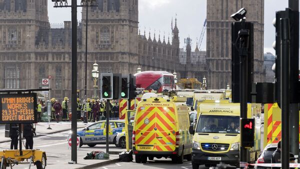 Police officers cordon off the territory near the U.K. Parliament in London where an assailant attacked a police officer and pedestrians. - Sputnik International