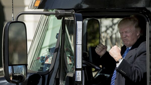 President Donald Trump gestures while sitting in an 18-wheeler truck while meeting with truckers and CEOs regarding healthcare on the South Lawn of the White House in Washington, Thursday, March 23, 2017. - Sputnik International