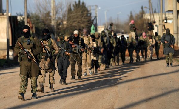 Fighters from the Ahrar al-Sharqiya rebel group walk with their weapons during a training near the northern Syrian town of al-Rai, Syria March 20, 2017 Fighters from the Ahrar al-Sharqiya rebel group walk with their weapons during a training near the northern Syrian town of al-Rai, Syria March 20, 2017 - Sputnik International