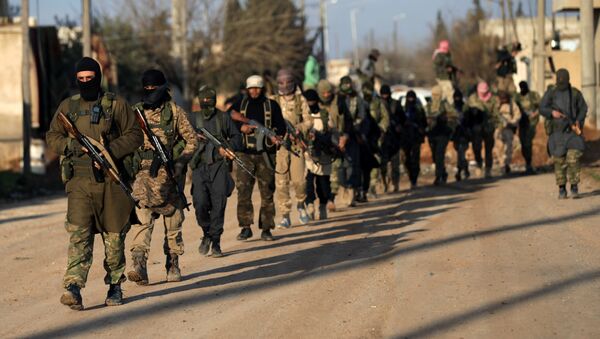 Fighters from the Ahrar al-Sharqiya rebel group walk with their weapons during a training near the northern Syrian town of al-Rai, Syria March 20, 2017 - Sputnik International