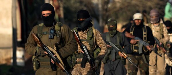 Fighters from the Ahrar al-Sharqiya rebel group walk with their weapons during a training near the northern Syrian town of al-Rai, Syria March 20, 2017 Fighters from the Ahrar al-Sharqiya rebel group walk with their weapons during a training near the northern Syrian town of al-Rai, Syria March 20, 2017 - Sputnik International